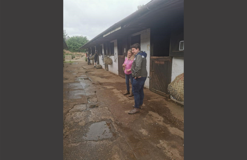 Shaun with Emma from Warren Hall Riding School in front of stables